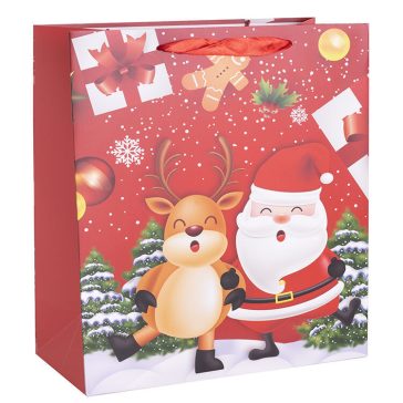   Ajándéktasak - közepes (táncoló rénszarvas és mikulás)